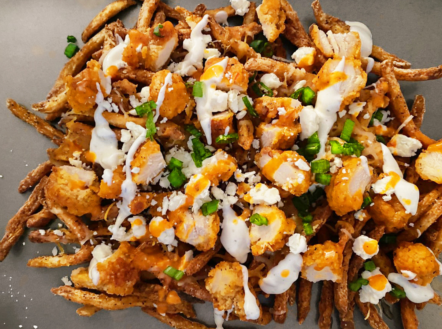 Buffalo Blue Cheese Fries made with Blonde Beard's Black Magic Buffalo Sauce