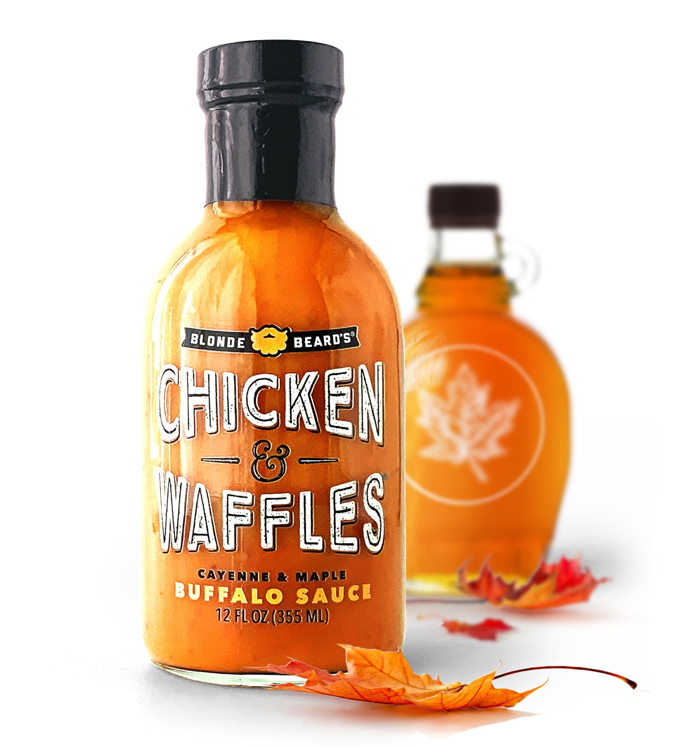 
                  
                    Bottle of Blonde Beard’s Chicken & Waffles buffalo wing sauce styled with maple syrup and maple leaves.

                  
                